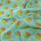 Floral Digital Print On Pastel Mint Green Base Muslin Fabric