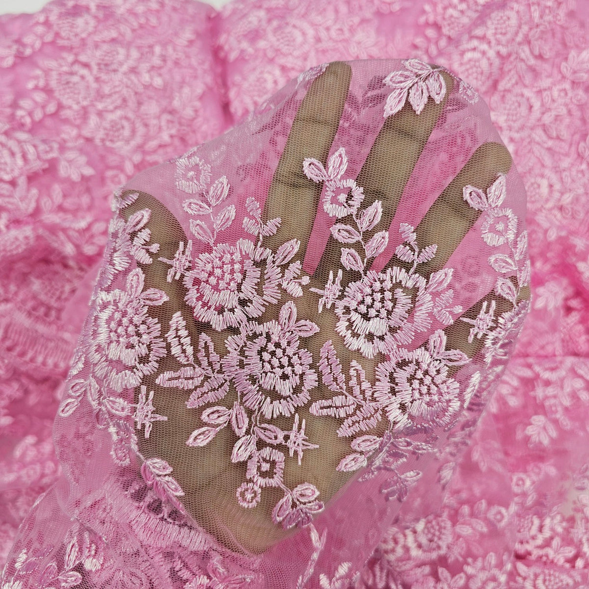 Embroidered Light Pink Net Fabric with Intricate rose patterns