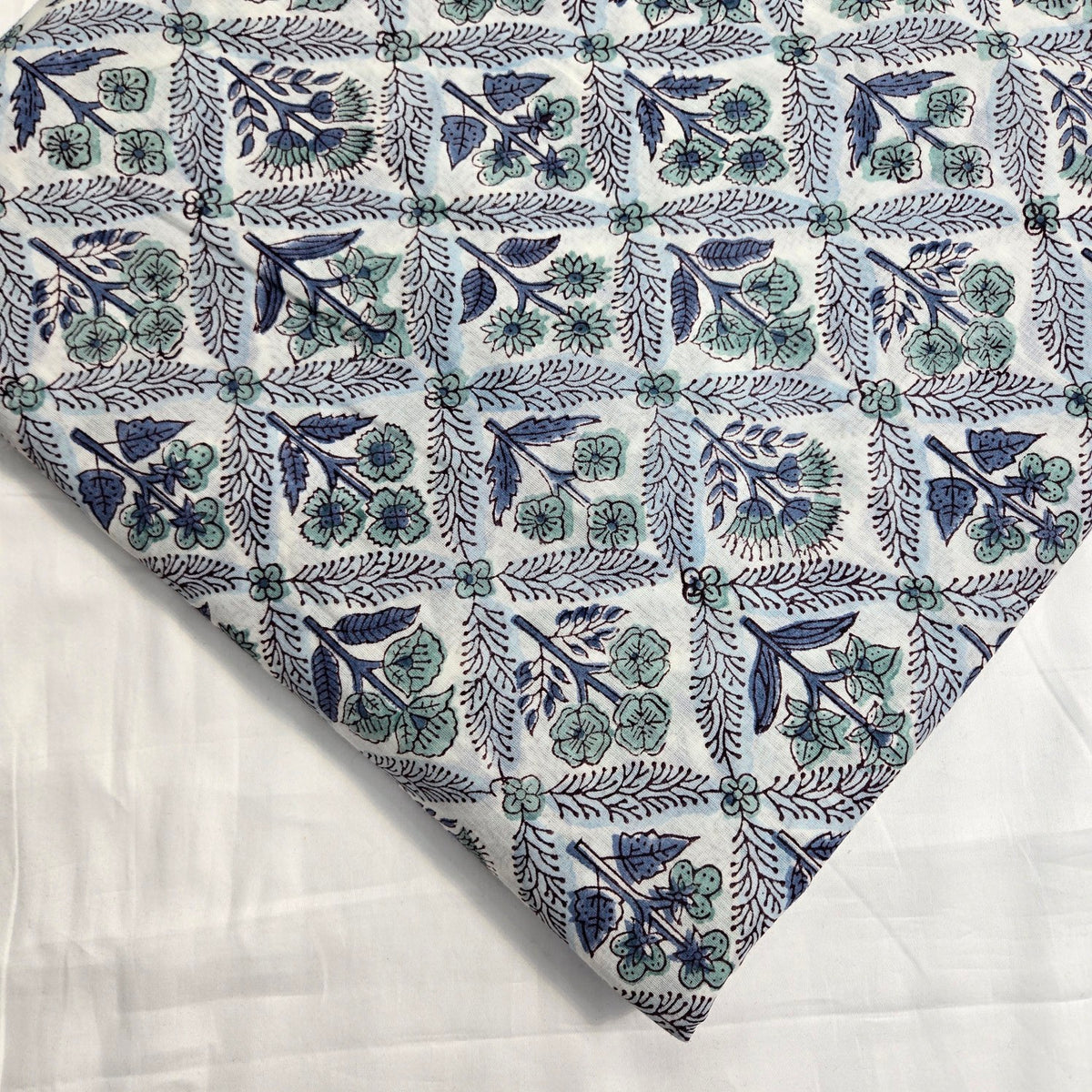 Digitally Printed Blue Flowers in Grid pattern on Off-white Mal Cotton Fabric