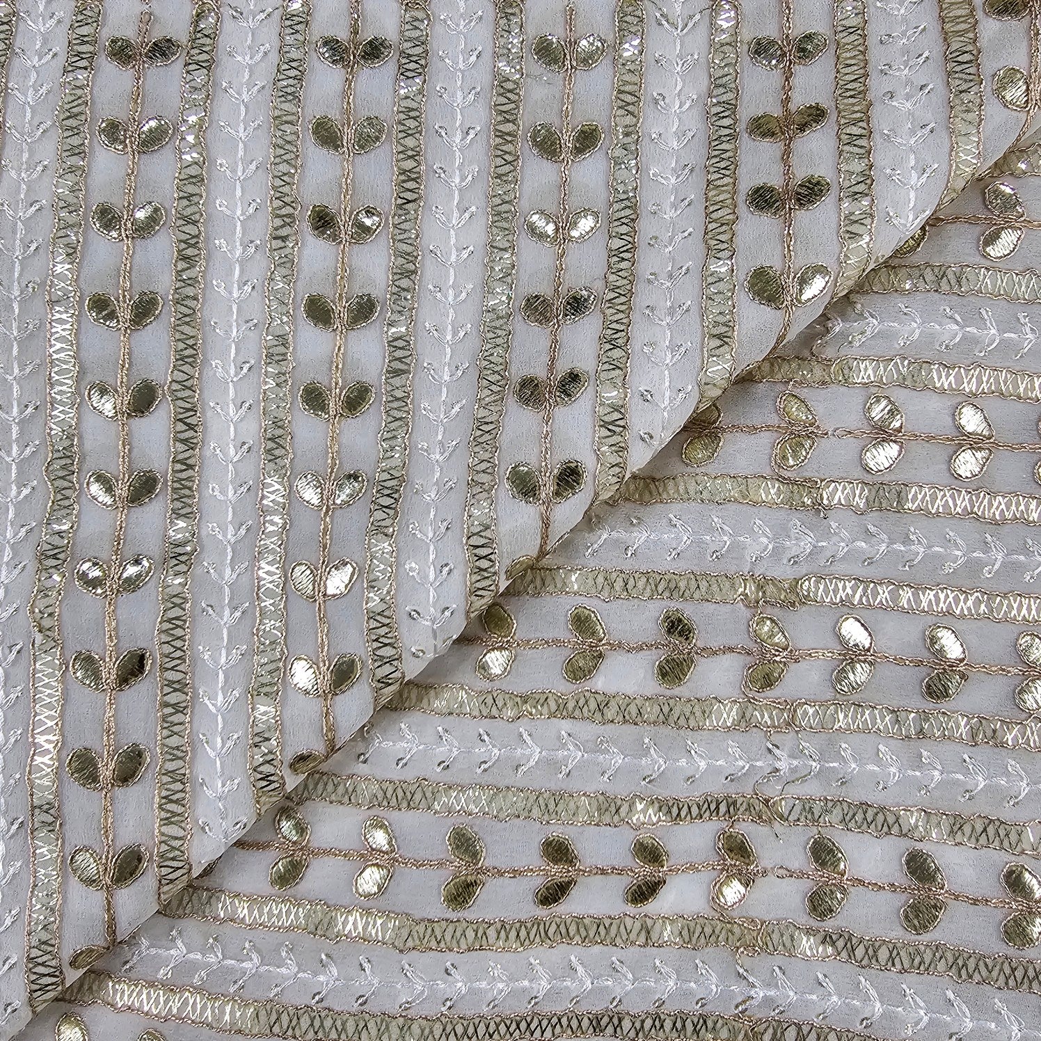 Kaneri Georgette Gota Patti Fabric on White Base