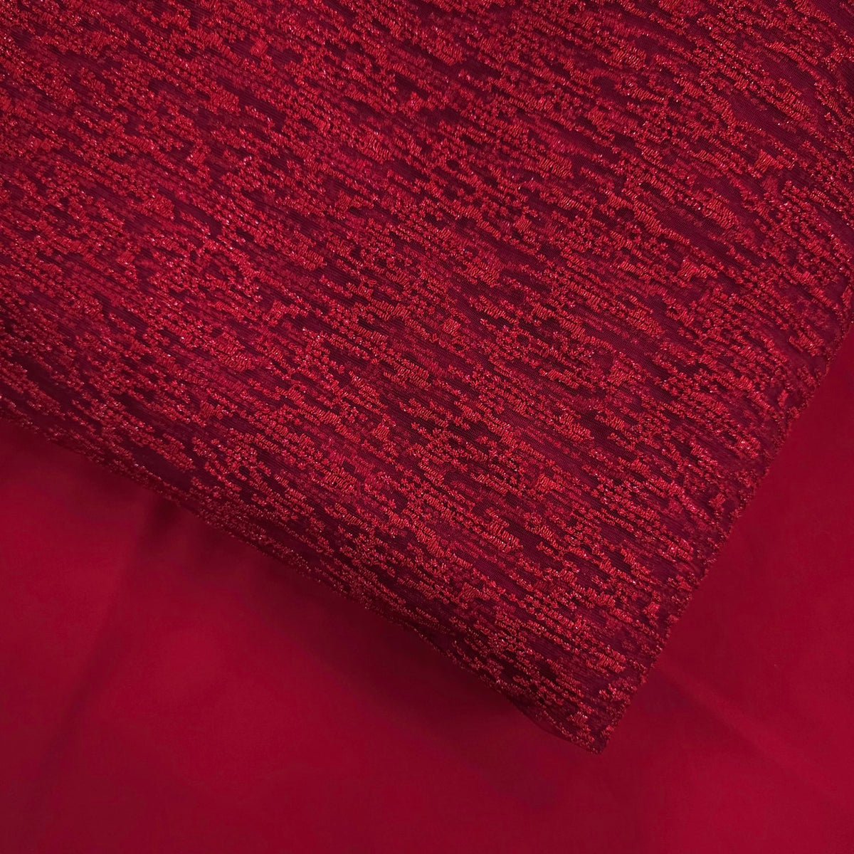 Embroidered Cherry Red Net Fabric with Textured pattern