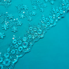 Embroidered Teal Blue Net Fabric with Floral Motifs
