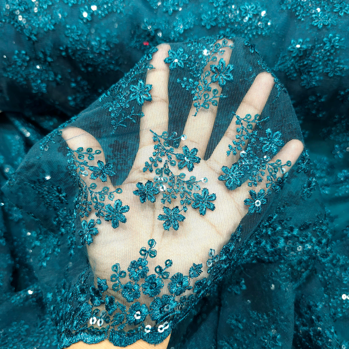 Embroidered Peacock Green Net Fabric with Floral Motifs