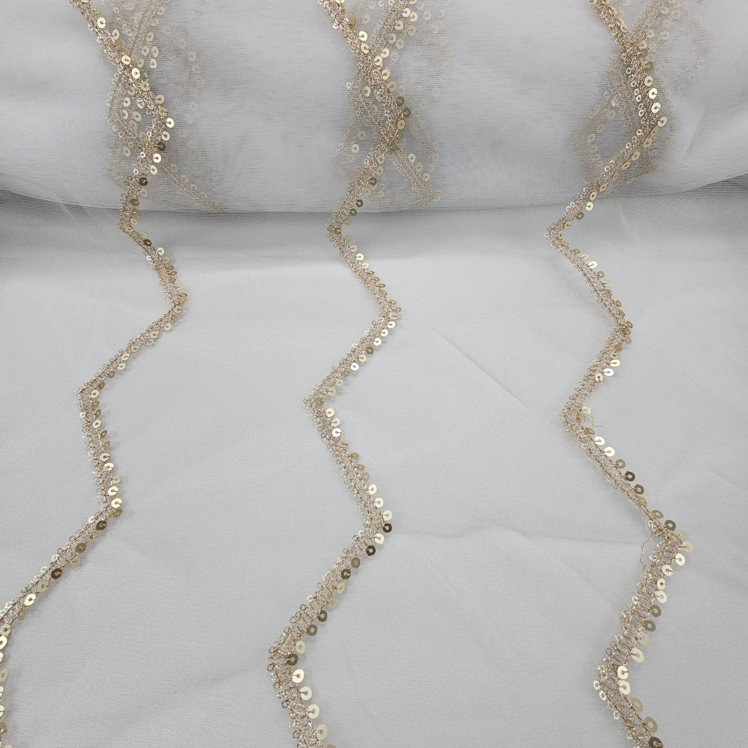 Rahat Gold Sequin & Zari Zig - Zag Embroidered Dyeable Net Fabric