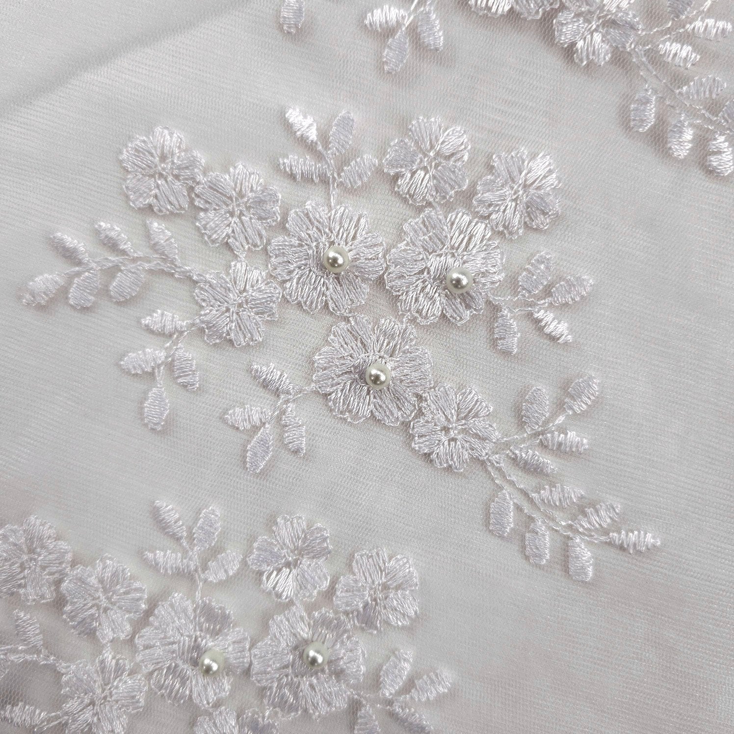 Camila White Pearl Lacey Net Floral Embroidered Fabric