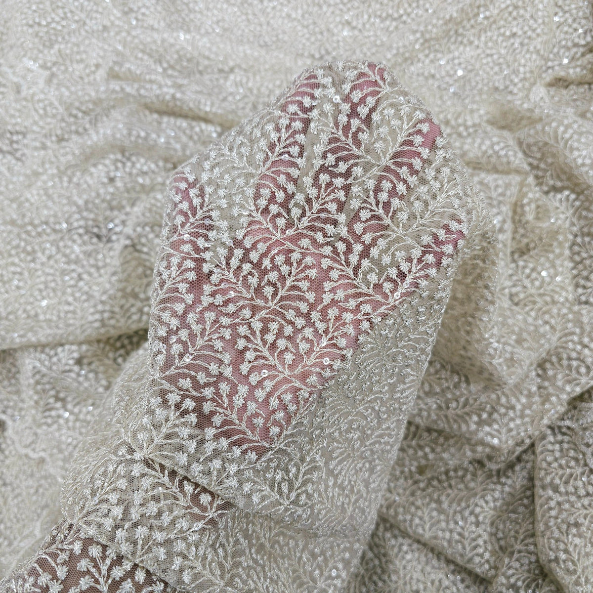 Embroidered Off-white Color Net Fabric with Intricate Floral patterns